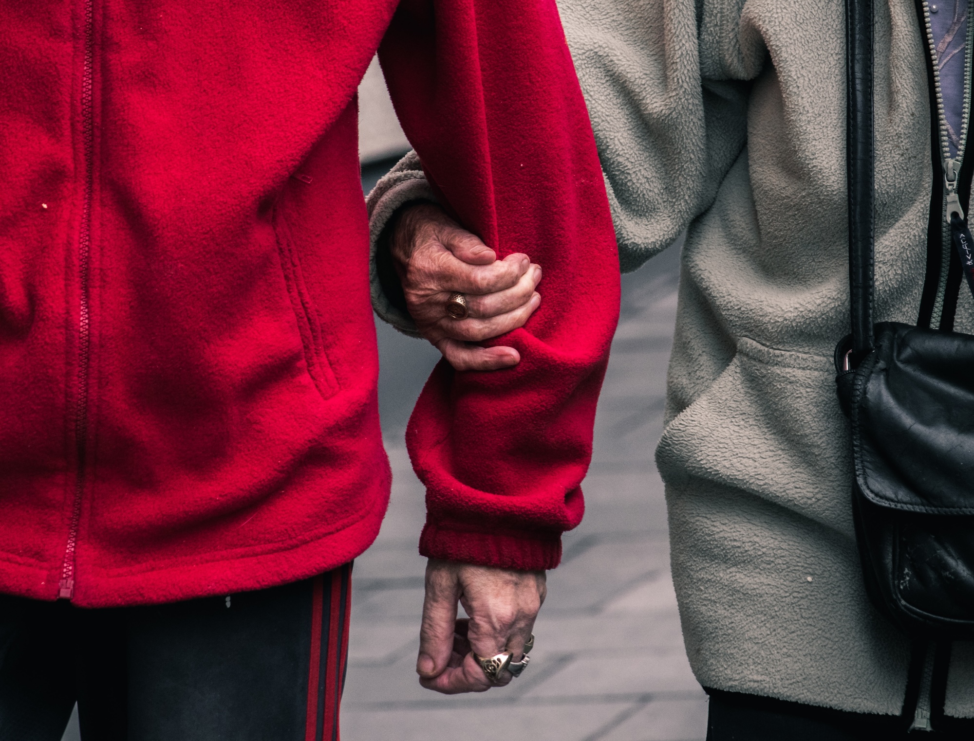 old couple holding hands